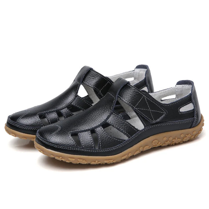 Orthopedic anti-slip sandals, black leather upper with open toe and cushioned tan sole