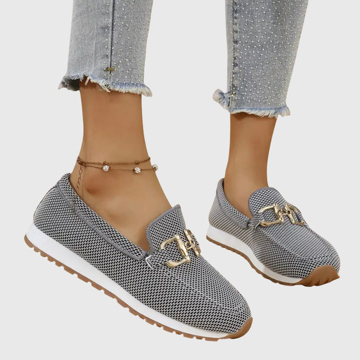 Gray chain-detail slip-on loafers with gold buckle hardware and textured mesh