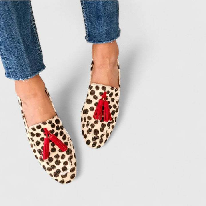 Leopard-print slip-on loafers with red tassel detail