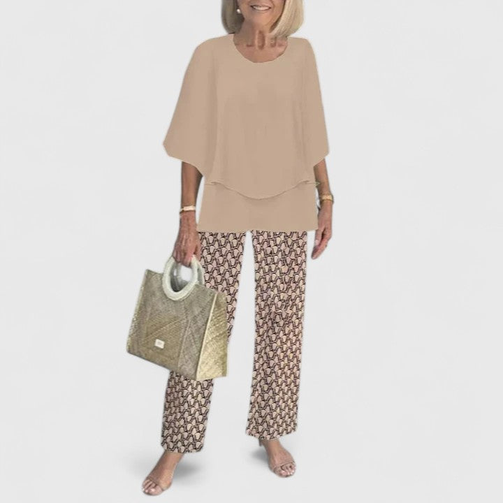 Two-piece blouse and trouser set with tan blouse and snakeskin-style print trousers