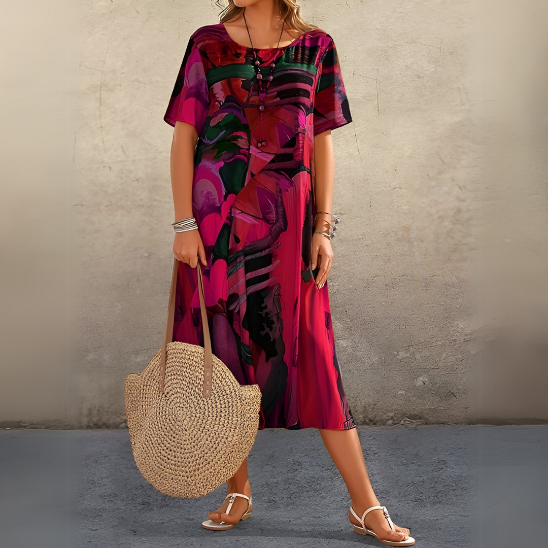 Floral midi dress with short sleeves, buttoned V-neck, abstract print on magenta fabric