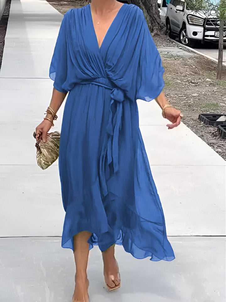 Blue chiffon V-neck dress with gathered waist tie and billowy mid-calf skirt