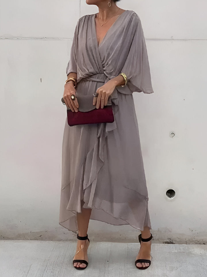 Light gray chiffon V-neck dress with gathered waist tie and airy mid-calf skirt