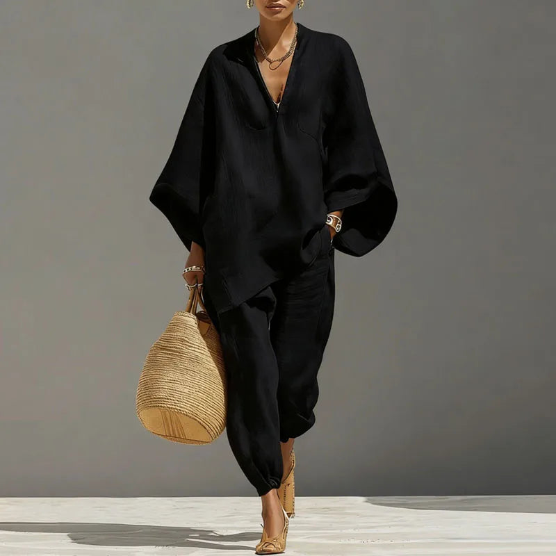 Black two-piece set with V-neck tunic, batwing sleeves, and cuffed jogger pants