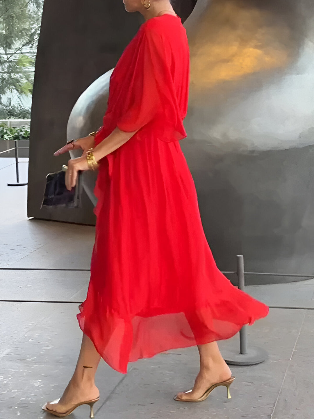 Red chiffon V-neck dress, side view, gathered waist tie and flowing mid-calf hem