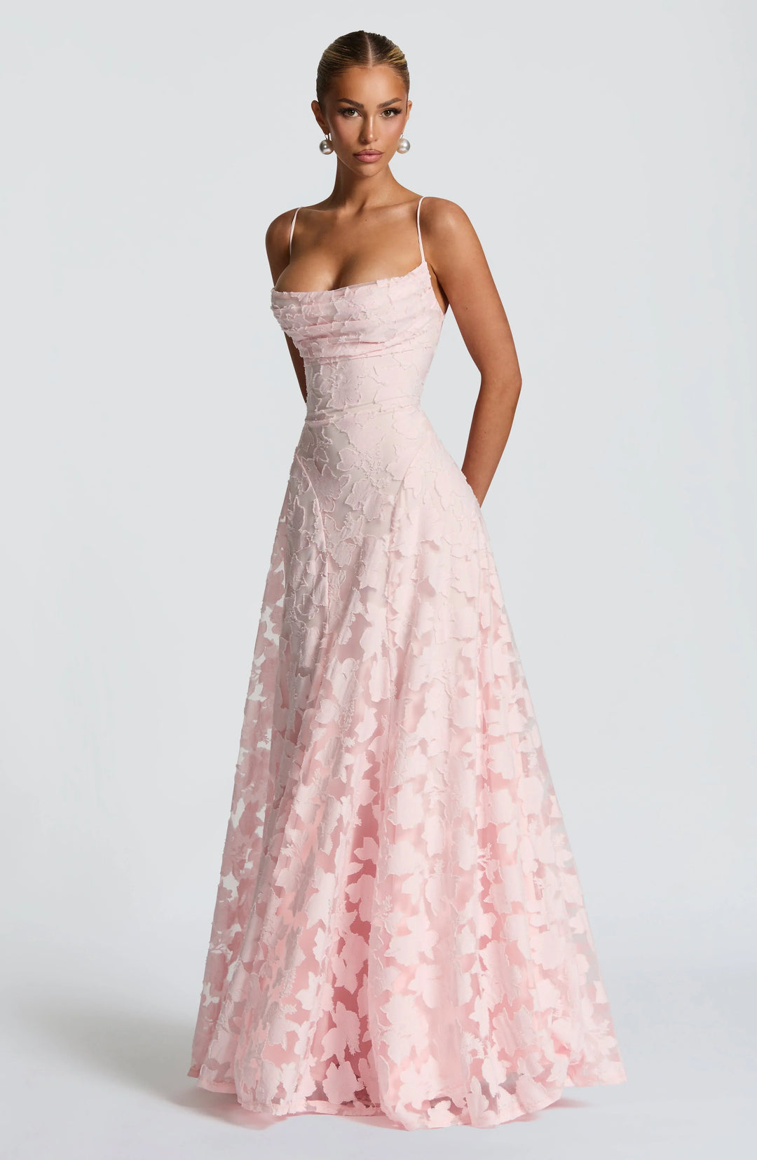 Pink floral spaghetti strap maxi dress with textured bodice and gathered flowing skirt