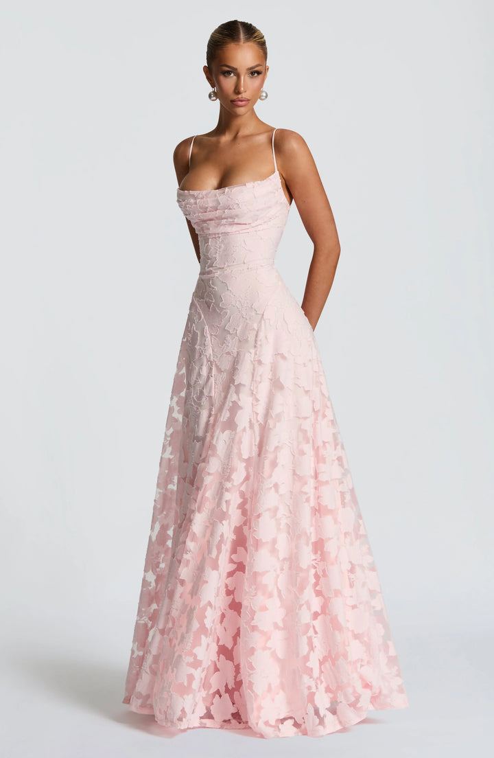 Pink floral spaghetti strap maxi dress with textured bodice and gathered flowing skirt