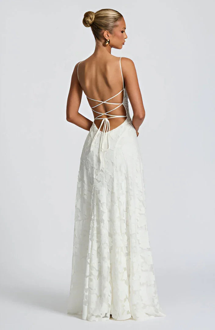 White floral maxi dress with spaghetti straps and crisscross open back with tie