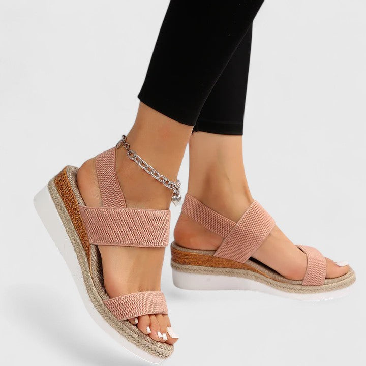 Women’s orthopedic sandals with arch support, blush woven straps and gold ankle chain.