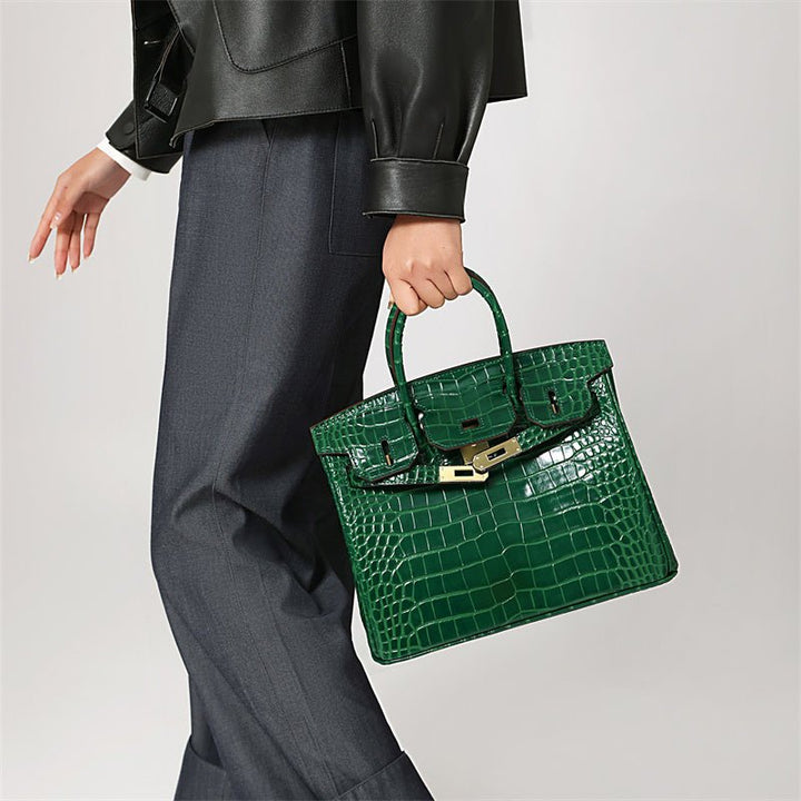 Green crocodile-texture handbag with top handle and gold buckle lock