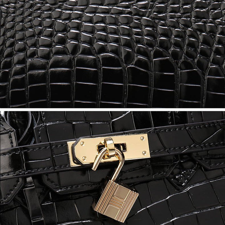 Black crocodile-texture handbag with gold lock clasp