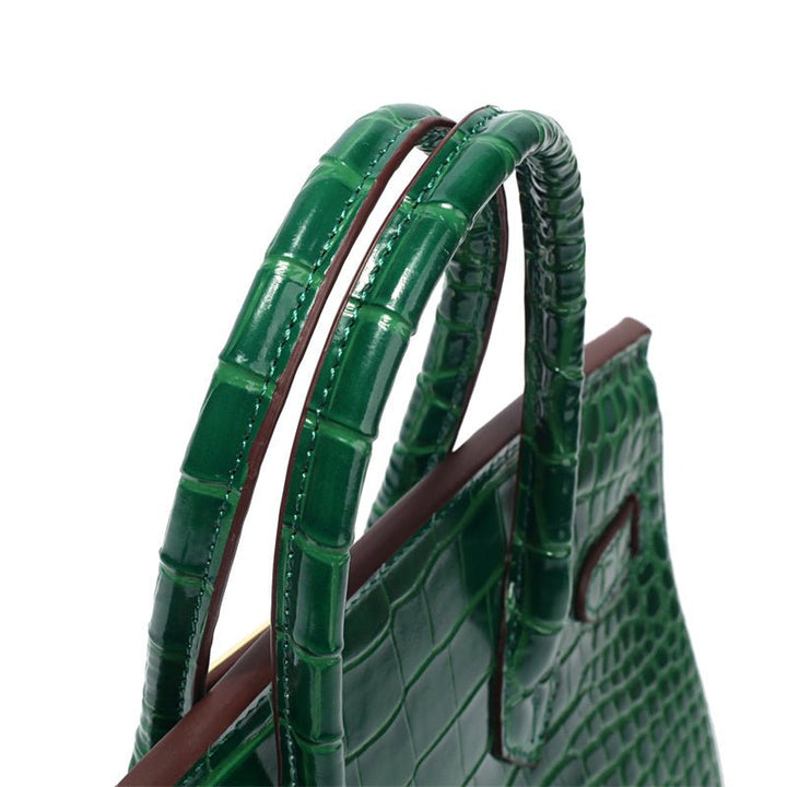 Green crocodile-textured handbag with double top handles