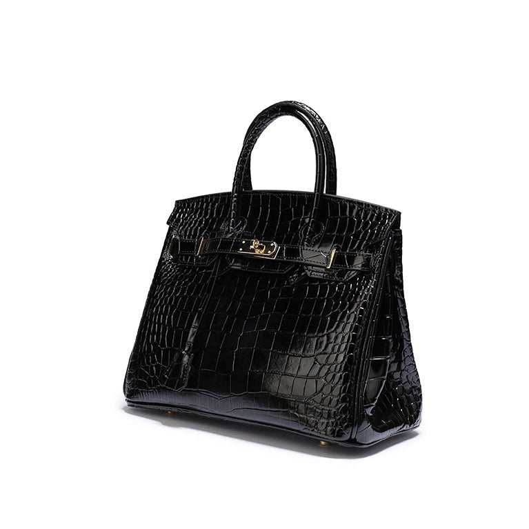Black croc-textured tote handbag with top handles and gold-tone front clasp