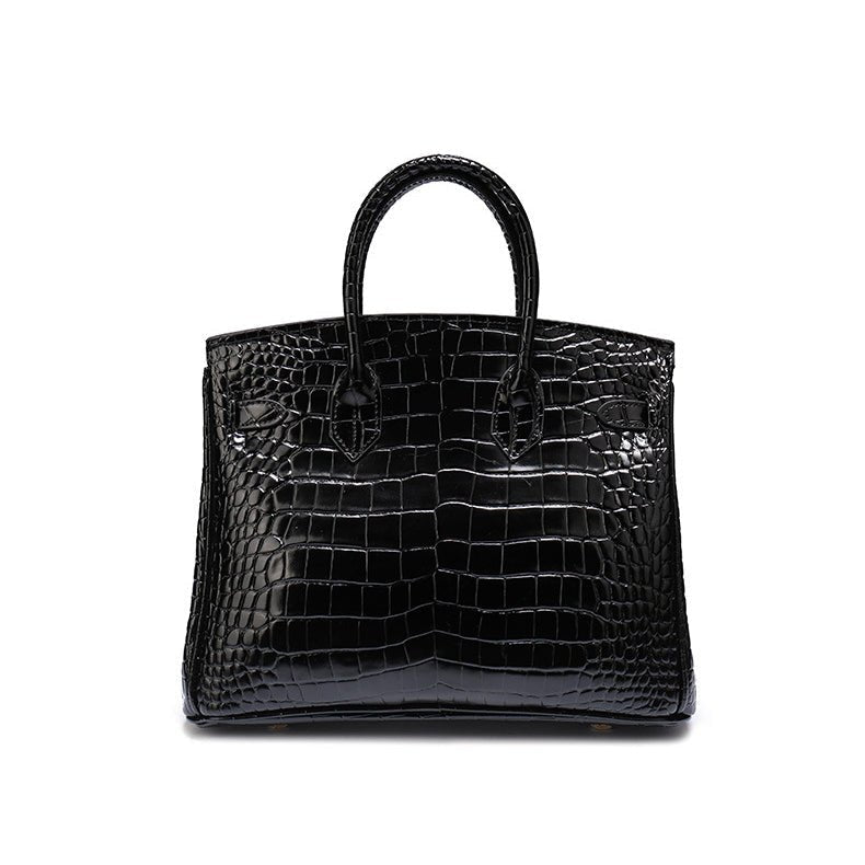 Black croc-textured tote handbag with top handles and flap front panel