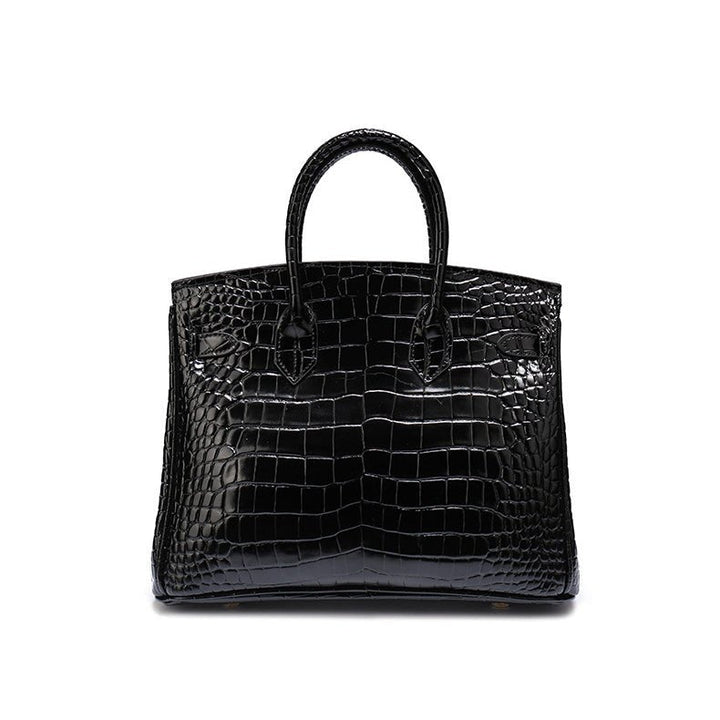 Black croc-textured tote handbag with top handles and flap front panel