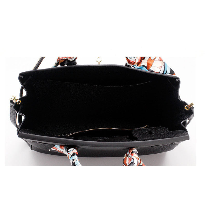 Black handbag interior with zipper and scarf-tie handles