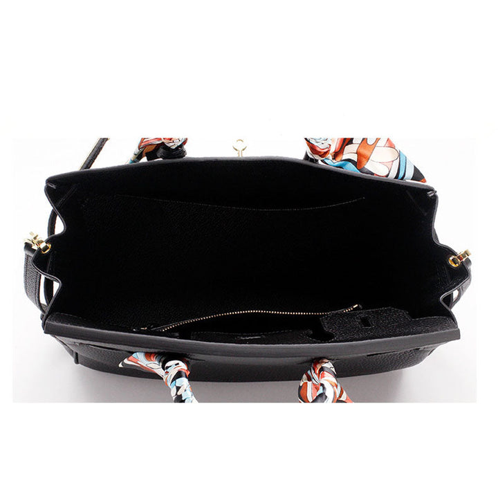 Black handbag interior with zipper and scarf-tie handles