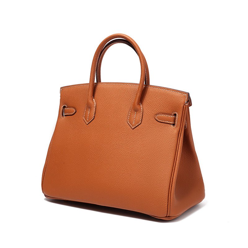 Women’s structured handbag in tan with top handles and side buckle details