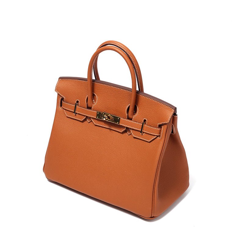 Women’s structured handbag in orange-brown with top handles and gold-tone hardware