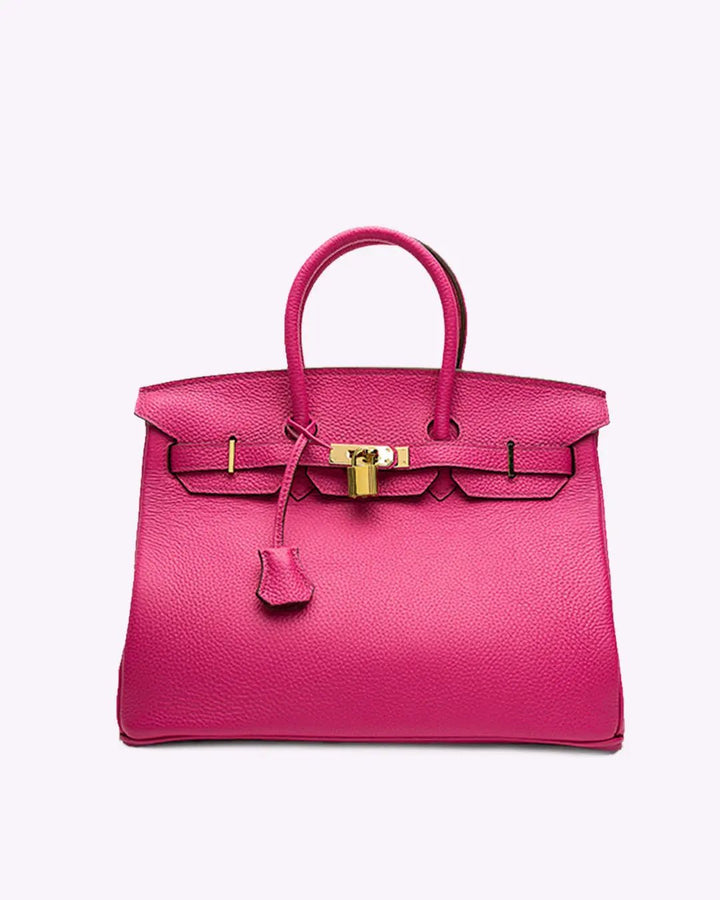 Pink leather handbag with top handles, front flap clasp, and gold-tone hardware.