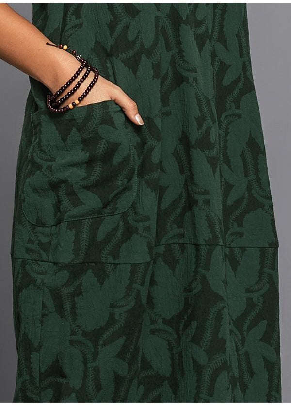 Green long sleeve midi dress fabric with leaf print and stitched yoke panel