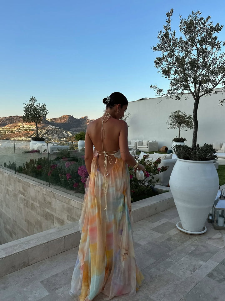 Orange printed halter maxi dress, open back with crisscross tie straps