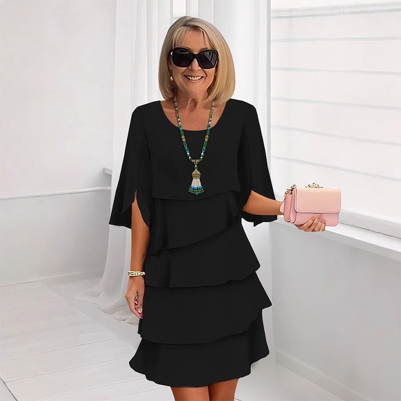 Black puff-sleeve layered dress with three tier ruffle skirt