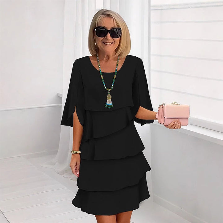 Black puff-sleeve layered dress with three tier ruffle skirt
