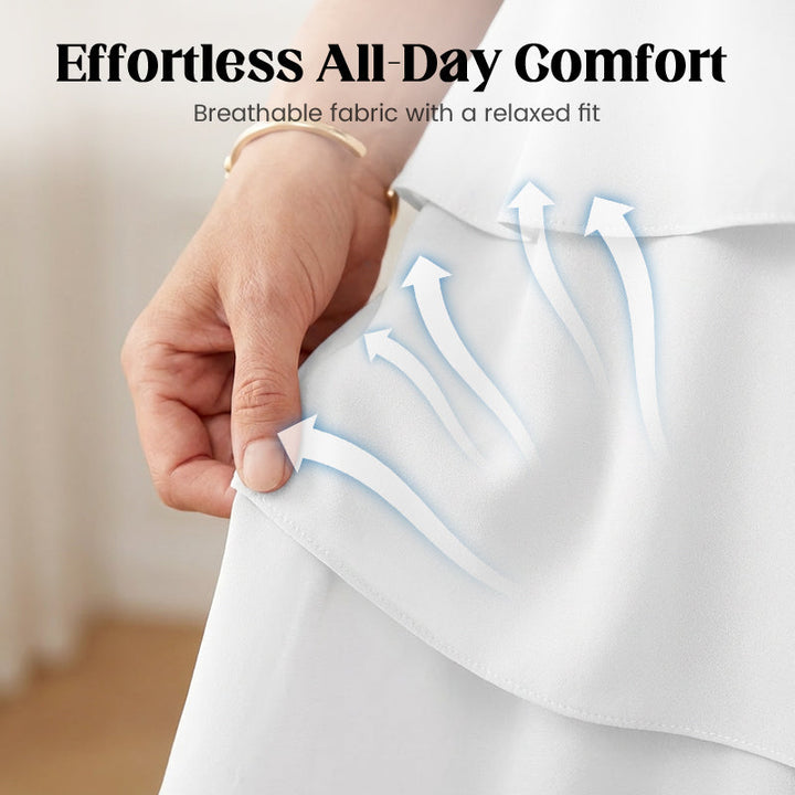 White tiered layered dress showing soft ruffle seam detail near the waist