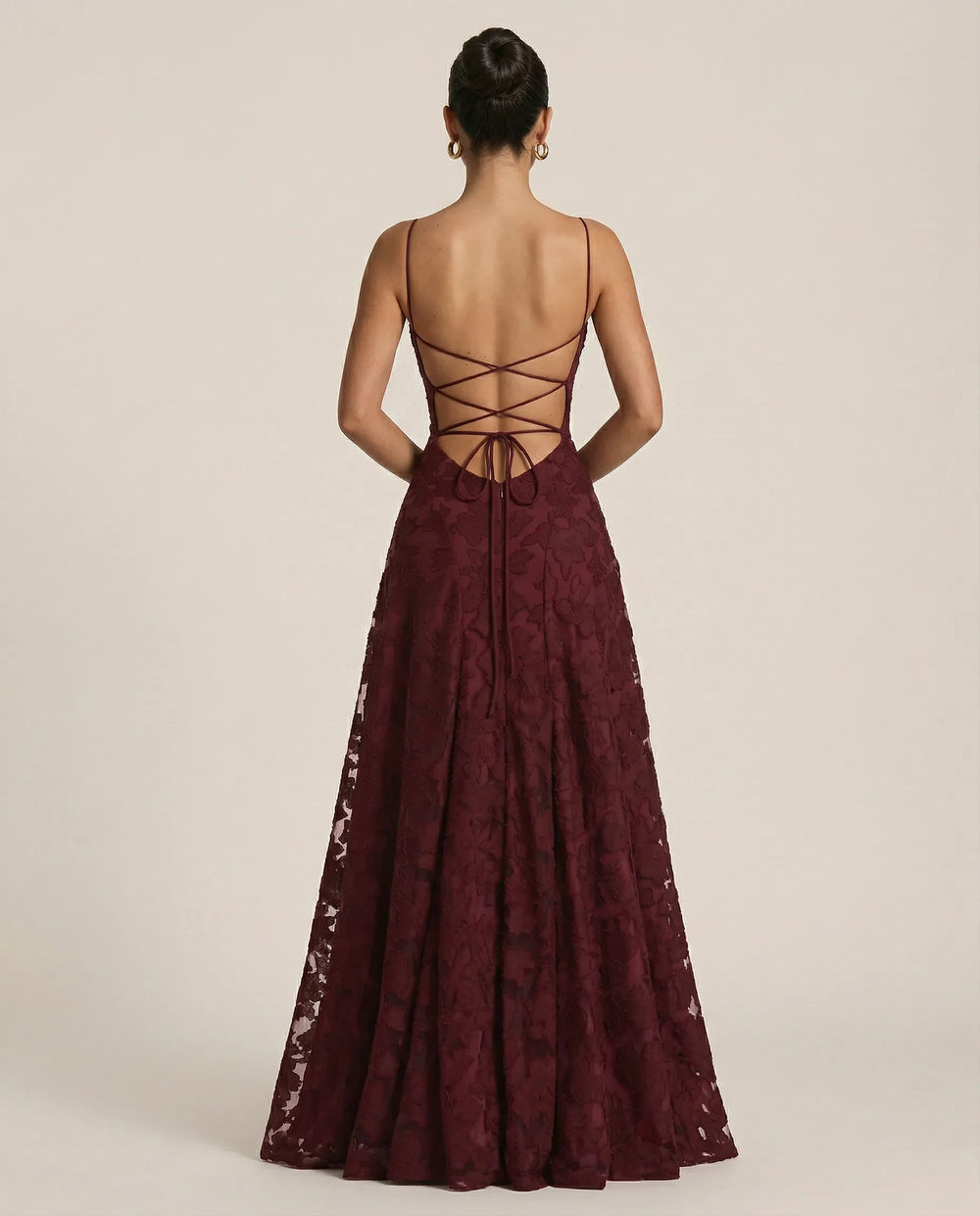 Burgundy spaghetti strap maxi dress with crisscross open-back lace design
