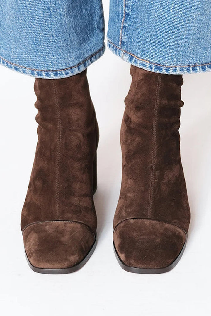 Brown suede square-toe heeled boots, rear view with side seam stitching