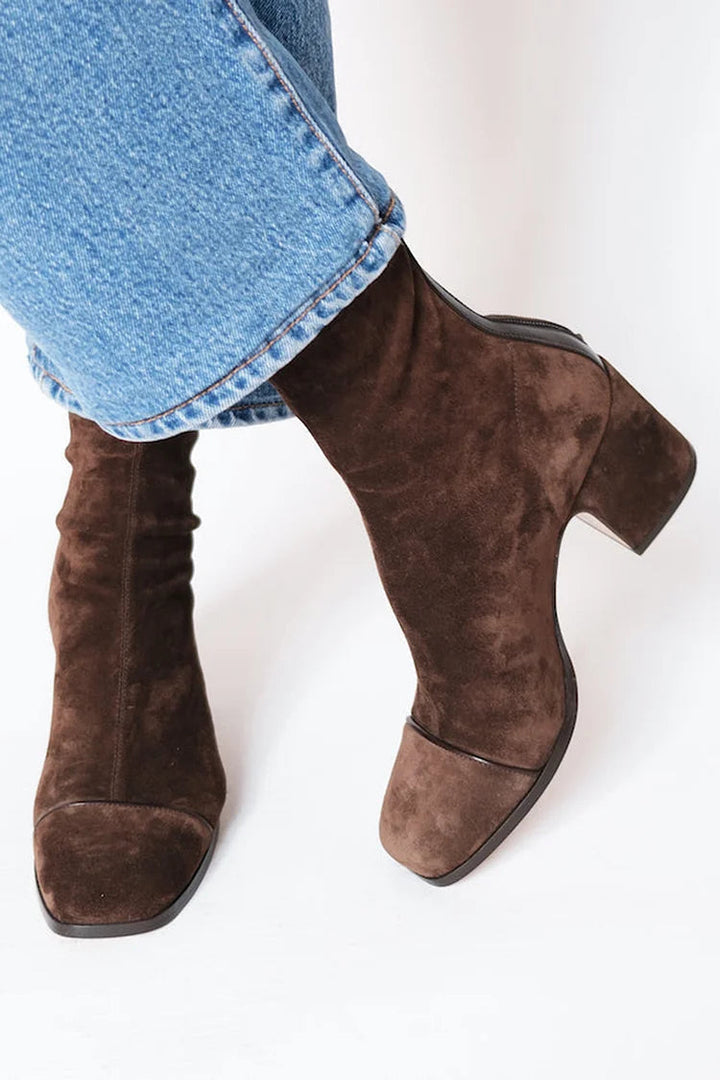 Brown square-toe heeled boots with suede-like finish and ankle shaft