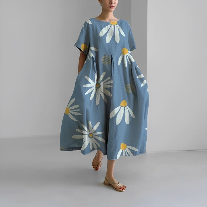 Floral flow midi dress in light blue with white daisy prints and yellow centers, loose.